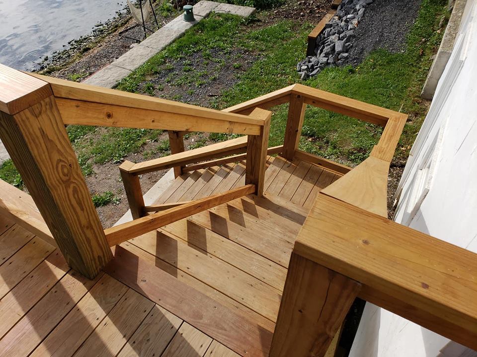 A construction of a deck and stairs near the shore